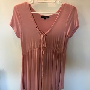 Super cute light pink flowy top. Not brandy